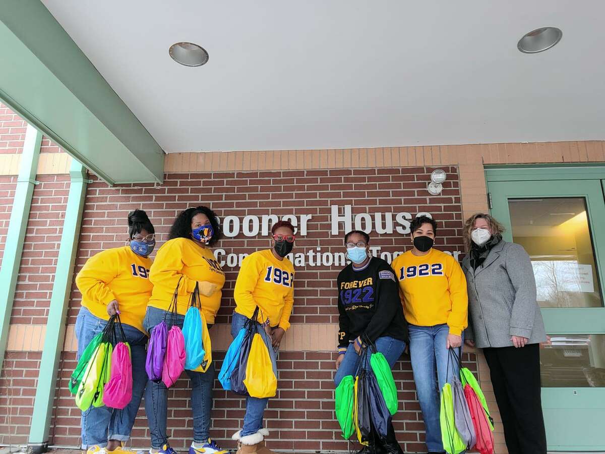 Sigma Gamma Rho Sorority’s Iota Chi Sigma Alumnae Chapter members, left to right, Telisha Jackson, Sheree Amankwah, Dr. Natasha Wright, Ashley Beal and Tanya Henneghan with Spooner House Executive Director Susan Agamy. The chapter donated 100 gift bags as part of its Project Warm Heart initiative Sunday, Jan. 9.