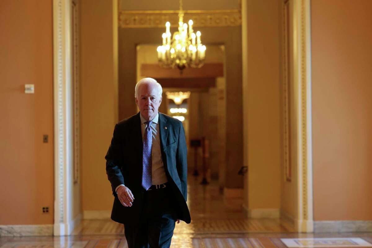 U.S. Sen. John Cornyn, R-Texas, seen here walking through the Capitol in January, has been tapped to represent Senate Republicans in talks with Democrats over possible compromise on guns.