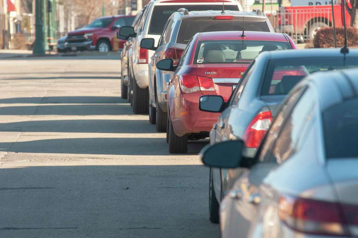 Parked cars line Jacksonville's West Court Street on Tuesday afternoon. The city will look at the ordinance governing long-term parking in the city to determine if it needs to be amended.