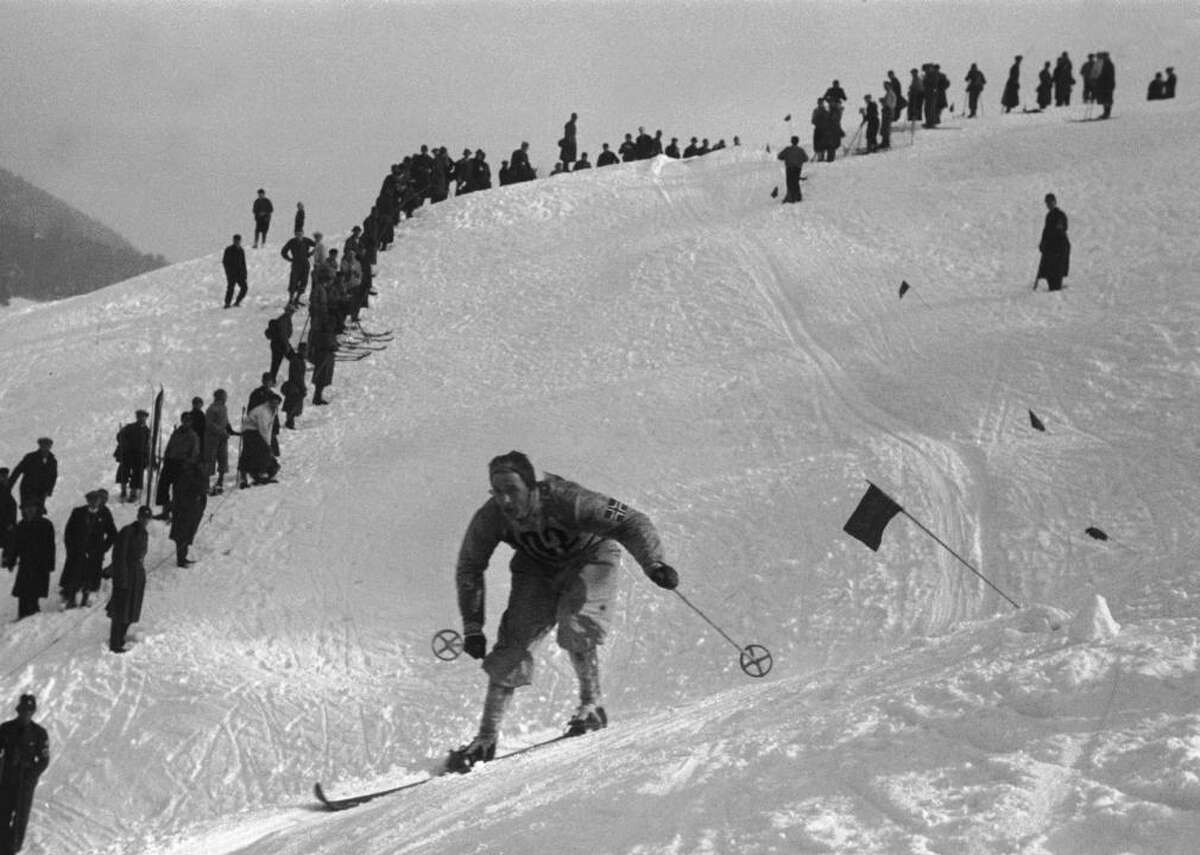 1936: Alpine skiing debuts at Winter Olympics Alpine skiing made its Olympic debut in men’s and women’s combined at the 1936 Berlin Games. It came six years after the FIS first recognized downhill ski racing as a sport. The governing body founded in 1924 initially only recognized Nordic events of cross-country skiing. Sir Arnold Lunn, a British skier who created slalom by putting gates (paired poles for the skier to pass through) on the course, is responsible for successfully lobbying the FIS in 1930 to officially recognize competition in alpine skiing and slalom. He also assisted with the 1936 games at Garmisch-Partenkirchen. Host country Germany won four of the six medals available, sweeping gold and silver.