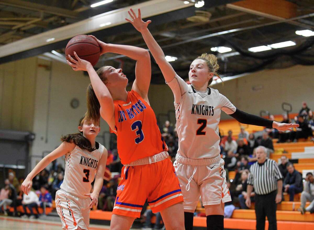 Danbury's Chloe Perreault (3) is pressured on her shot by Stamford's Megan Landsiedel (2) in the first half of a girls basketball game at Stamford High School on Feb. 19, 2020 in Stamford, Connecticut.