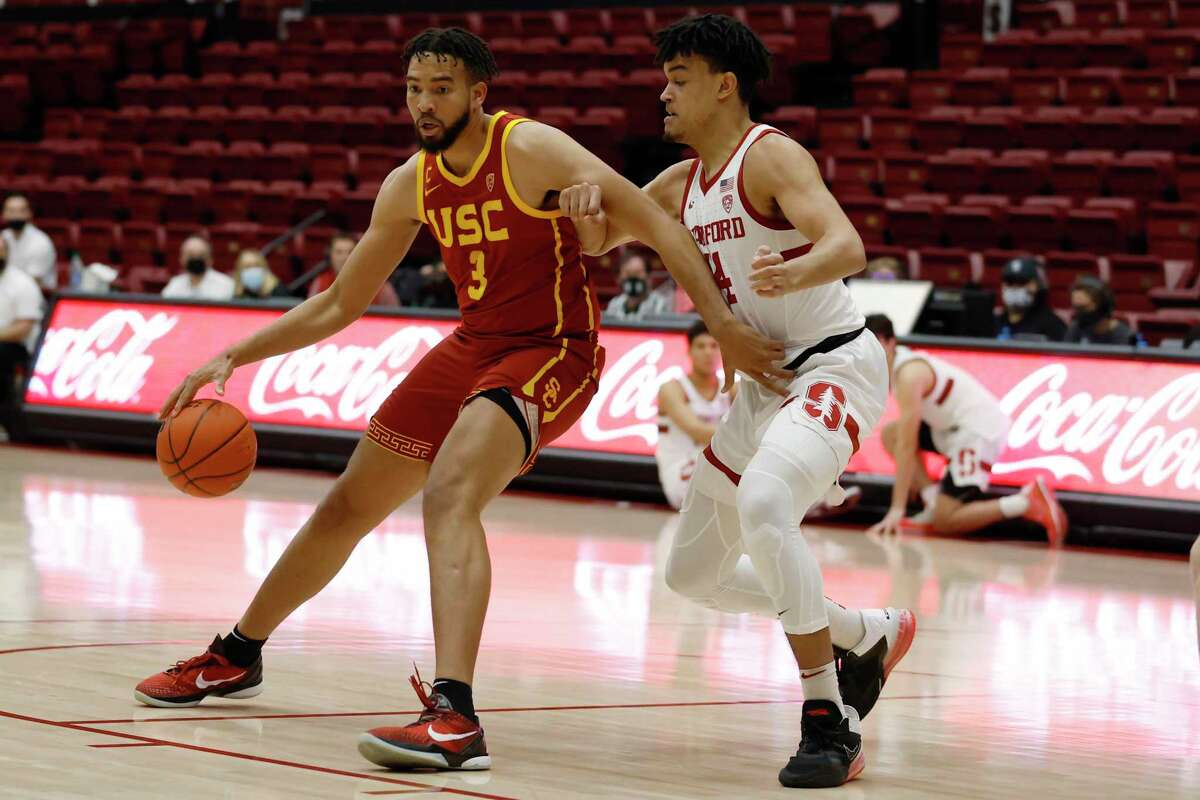 Southern California forward Isaiah Mobley (3) drives for the basket as Stanford forward Spencer Jones (14) defends during the first half of an NCAA college basketball game Tuesday, Jan. 11, 2022, in Stanford, Calif. (AP Photo/Josie Lepe)