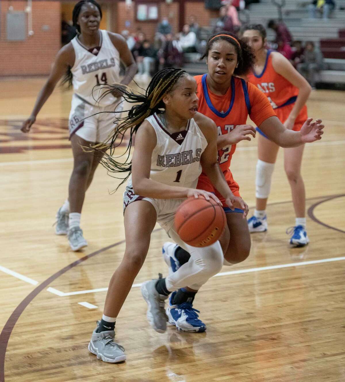 Legacy High's Myleah Young drives inside as San Angelo Central's Layla Young defends 01/11/2022 at Legacy High gym. Tim Fischer/Reporter-Telegram