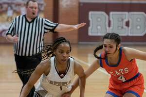 Legacy High's Myleah Young drives down the court as San Angelo Central's Jewels Perez defends 01/11/2022 at Legacy High gym. Tim Fischer/Reporter-Telegram