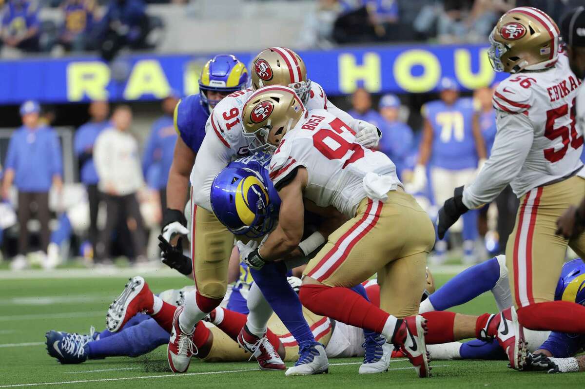 49ers defensive linemen Nick Bosa (97) and Arik Armstead (91) bring down the Rams’ Matthew Stafford in the second quarter.
