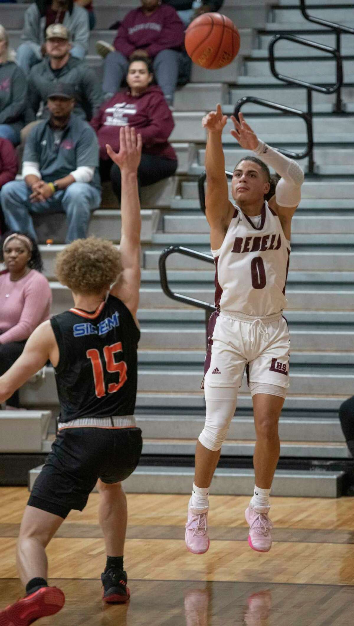 Legacy High's Donny Bishop puts up a three-point shot before San Angelo Central's Joseph Rowe can get out to defend 01/11/2022 at Legacy High gym. Tim Fischer/Reporter-Telegram