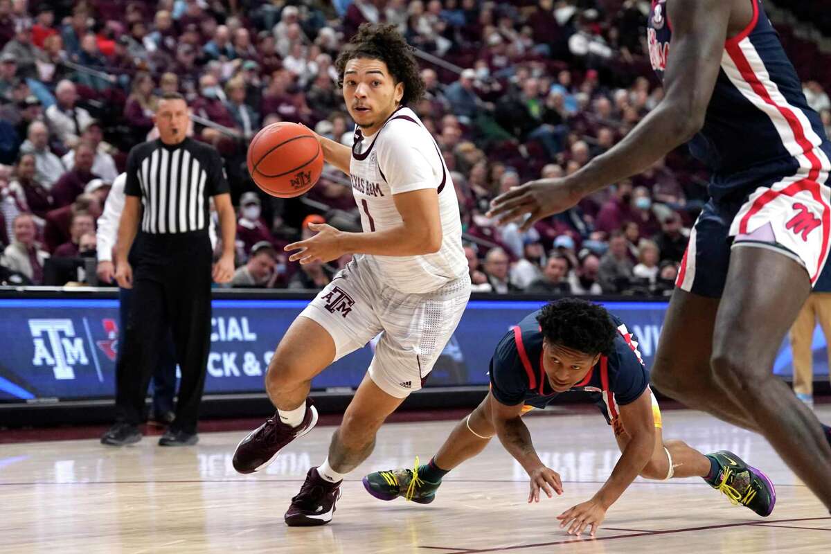 Texas A&M guard Marcus Williams (1) drives past Mississippi guard Daeshun Ruffin (2) for a basket during the second half Tuesday, Jan. 11, 2022, in College Station.