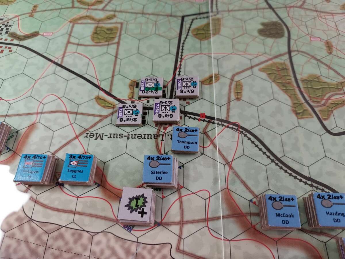 Shore bombardment counters have been placed on the defenders of Omaha Beach. A roll of the die will determine how much damage each bombardment inflicts.  