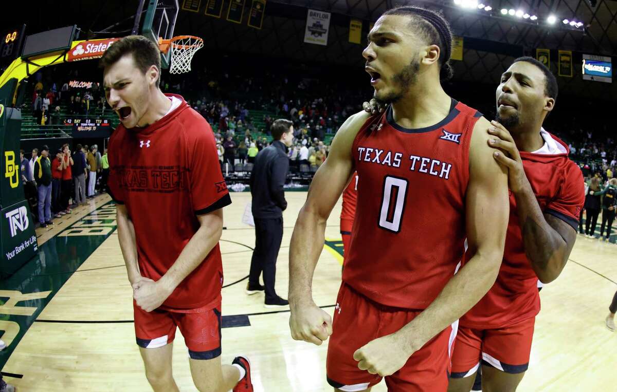 WACO, TX - JANUARY 11: Kevin Obanor #0 of the Texas Tech Red Raiders celebrates with teammates following Techs 65-62 win over the Baylor Bears at the Ferrell Center on January 11, 2022 in Waco, Texas. (Photo by Ron Jenkins/Getty Images)