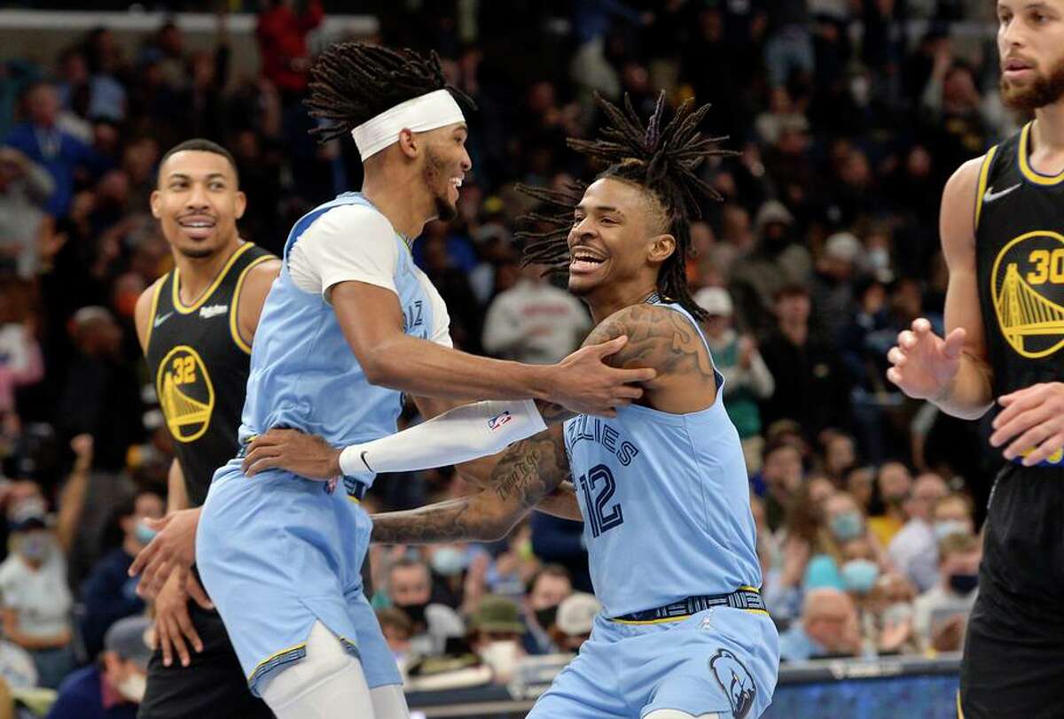 Morant (12) and Ziaire Williams celebrate as Memphis beat the Warriors for the seventh time in their last 11 meetings.