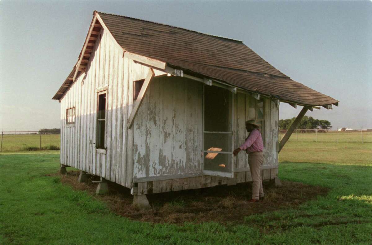 Kenny Rogers looks at the sharecropper's cottage, the latest attraction for the George Ranch.
