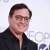 Bob Saget arrives at the People's Choice Awards at the Microsoft Theater on Wednesday, Jan. 18, 2017, in Los Angeles. Saget, a comedian and actor known for his role as a widower raising a trio of daughters in the sitcom "Full House," has died, according to authorities in Florida, Sunday, Jan. 9, 2022. He was 65.