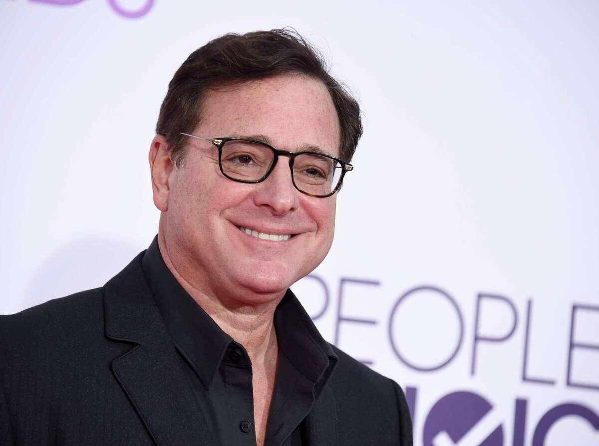 Bob Saget arrives at the People's Choice Awards at the Microsoft Theater on Wednesday, Jan. 18, 2017, in Los Angeles. Saget, a comedian and actor known for his role as a widower raising a trio of daughters in the sitcom "Full House," has died, according to authorities in Florida, Sunday, Jan. 9, 2022. He was 65.