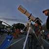 Astronomer John Whisenhunt lets people look through his five-inch refractor telescope to get a view of the planets Venus and Jupiter during a viewing party by the star-gazing group, San Antonio League of Sidewalk Astronomers (SALSA), at McAllister Park on Tuesday, June 30, 2015. (Kin Man Hui/San Antonio Express-News)