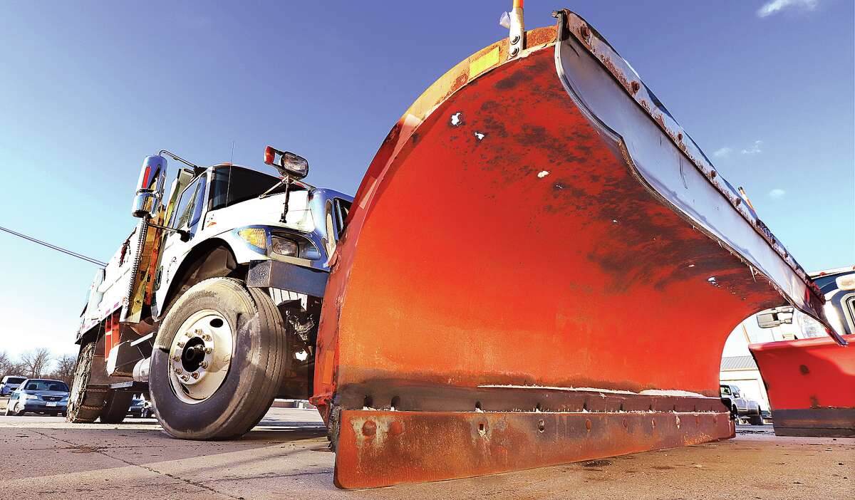 John Badman|The Telegraph Thanks to last Saturday's ice storm, Alton Public Works crews are prepared for this weekend's possibility of snow. Nearly all of the city's large dump trucks on Wednesday had their snow plows attached and are filled with road salt.