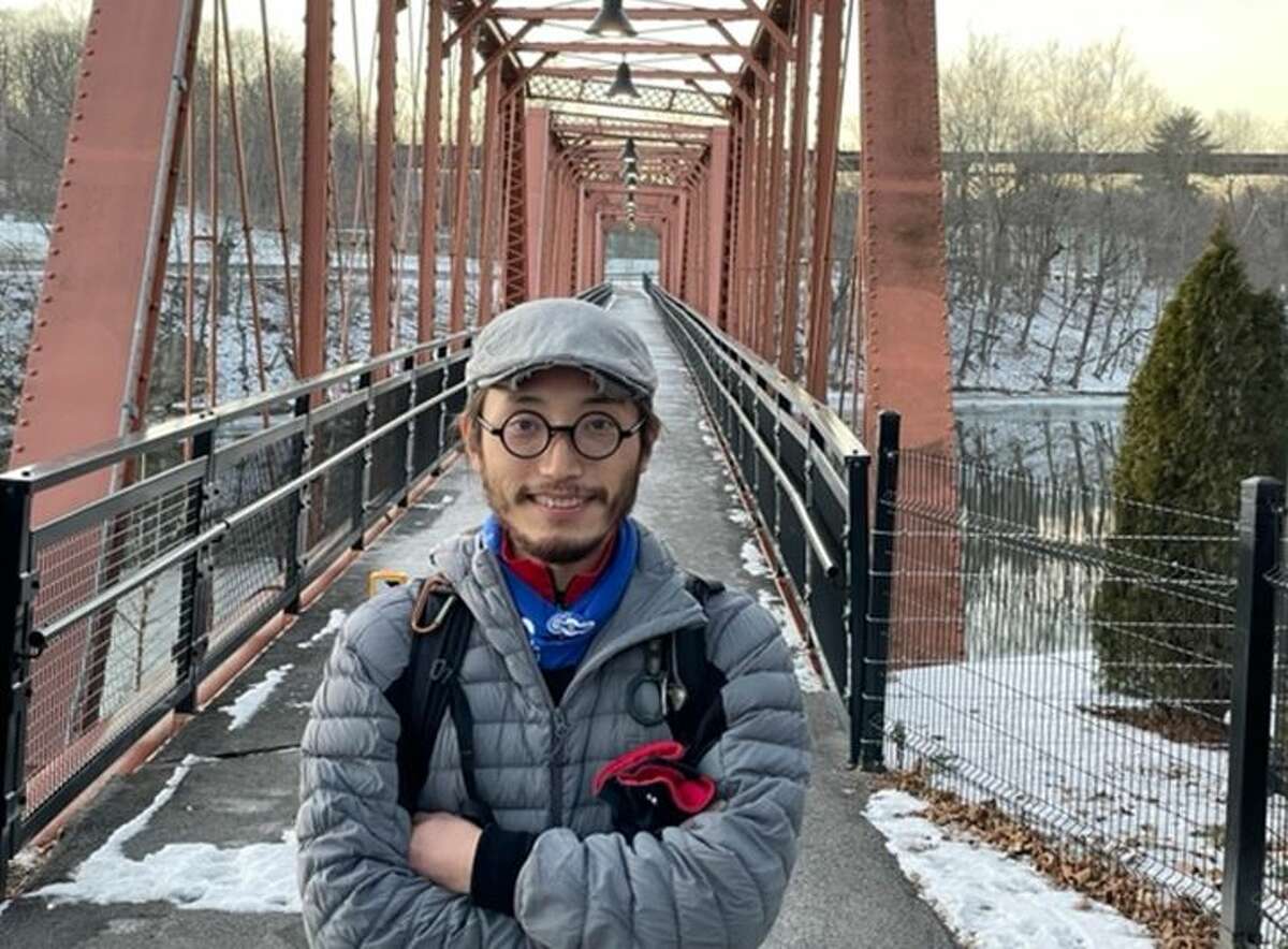 Chen Zhe, who left his home in China in 2015 to travel the world on a bike, recently stopped off in the Capital Region. He's pictured here in Catskill.