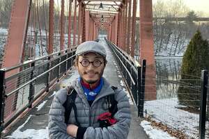 Chen Zhe, who left his home in China in 2015 to travel the world on a bike, recently stopped off in the Capital Region. He's pictured here in Catskill.