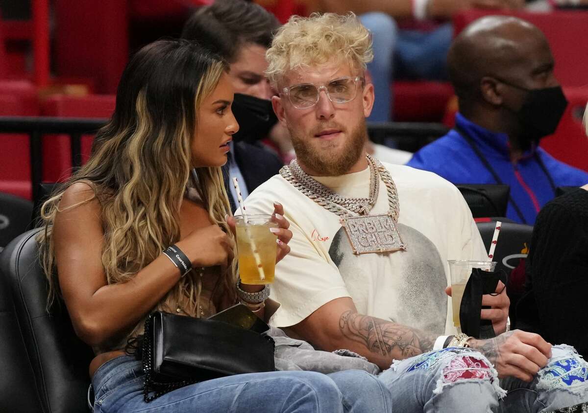Jake Paul and his girlfriend Julia Rose attend the game between the Miami Heat and the Detroit Pistons at FTX Arena on December 23, 2021 in Miami, Florida.