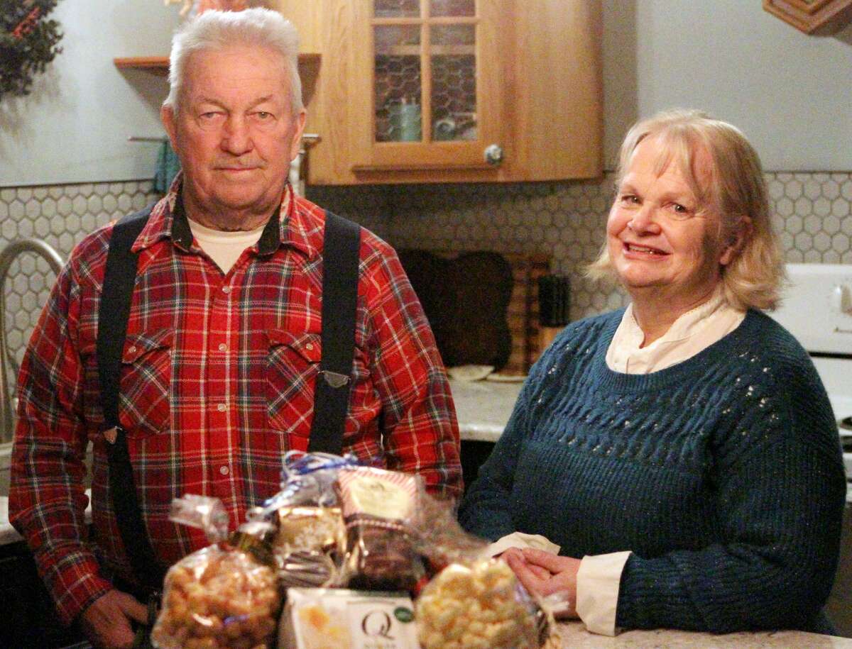 Alan Kearns and his wife, Cathy, stand in their newly remodeled kitchen, with a complimentary gift basket gracing the new counter top.