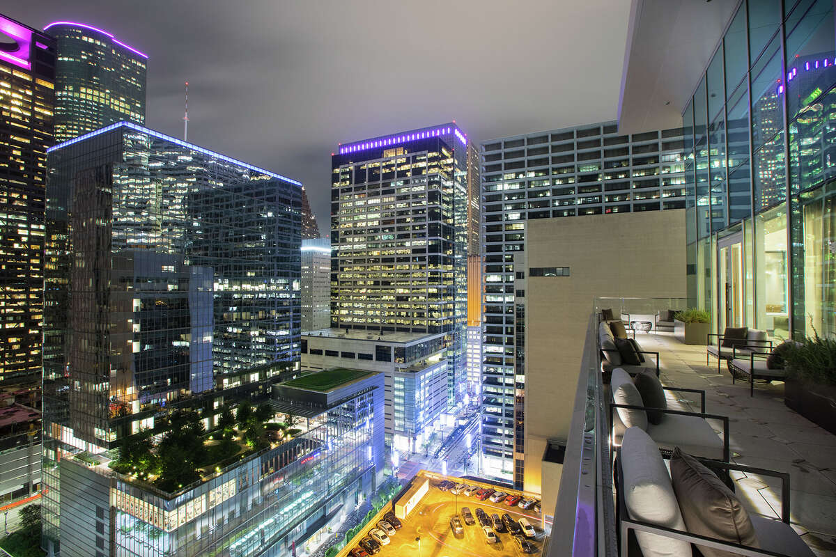 A balcony at The Laura Hotel offers a view of the downtown skyline
