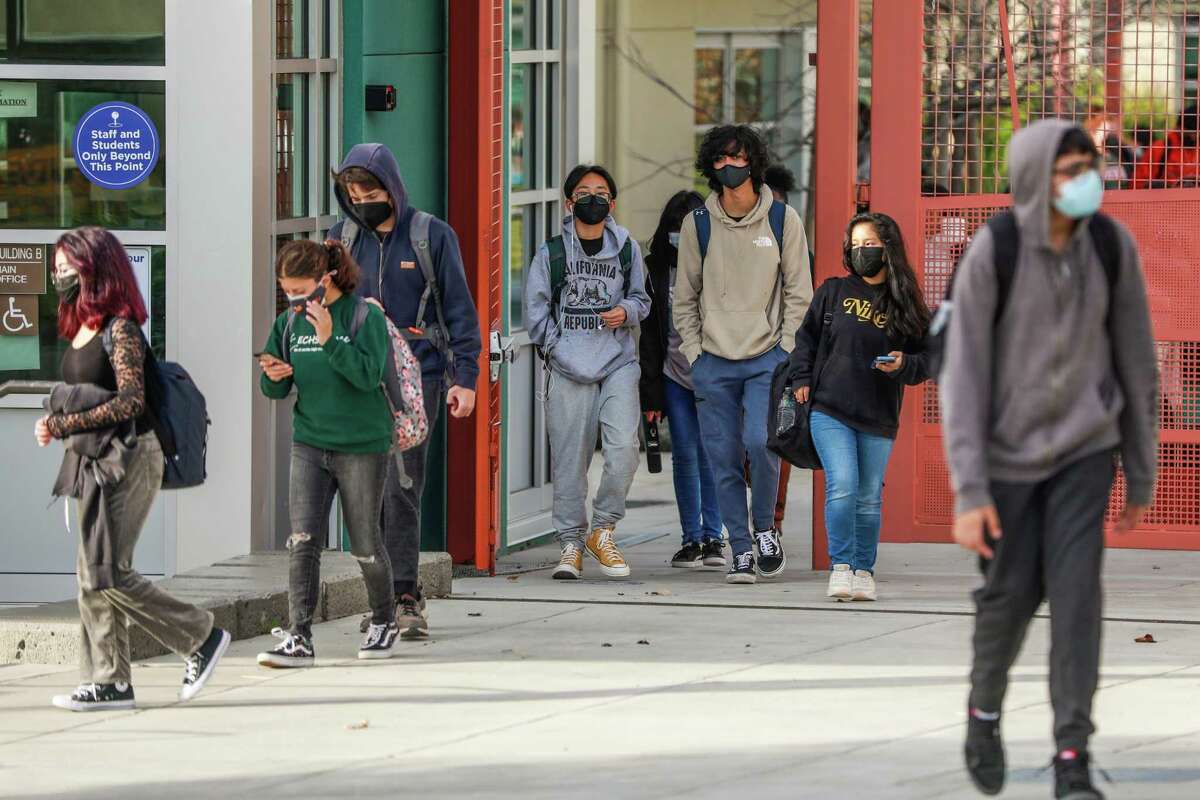 Students leave Korematsu Middle School in El Cerrito at the end of the day on Tuesday. Many school districts are grappling with how to teach classes during the surge in omicron infections.