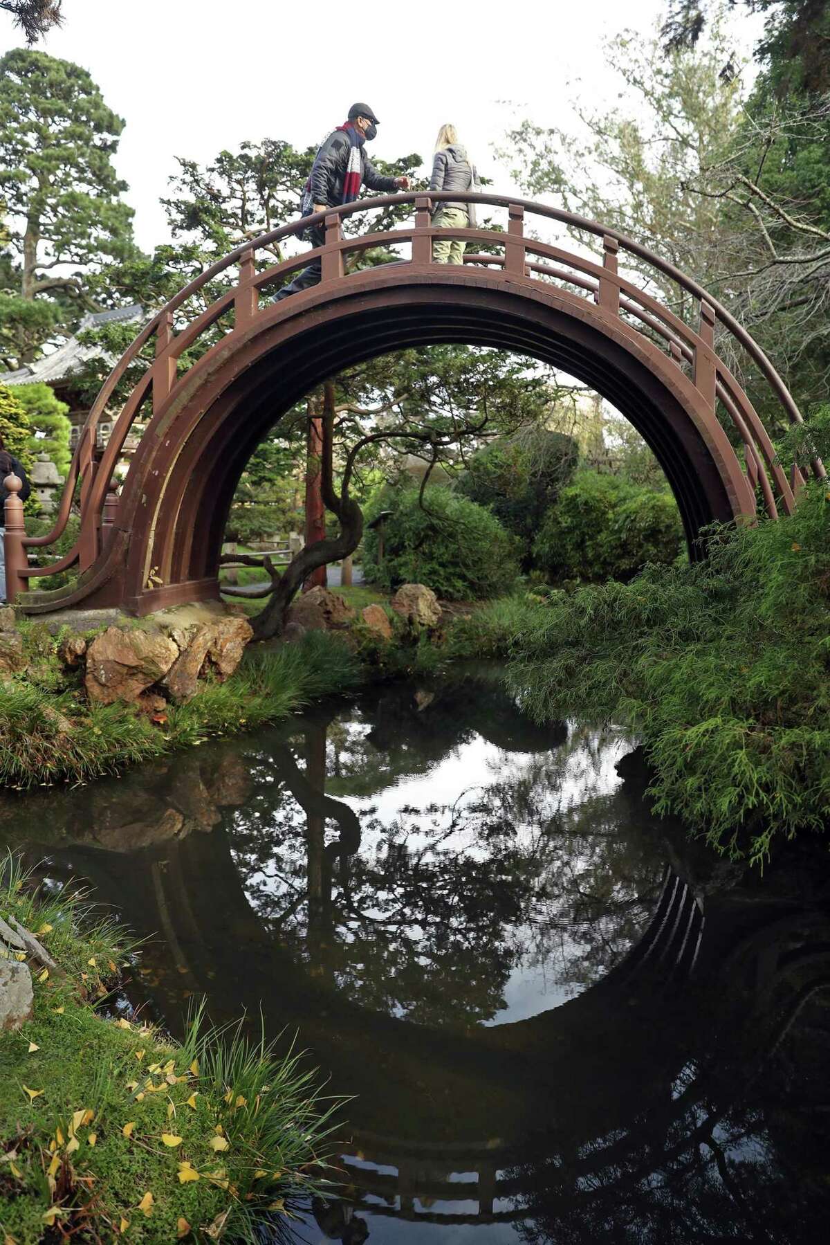 The arched drum bridge at the Japanese Tea Garden, which features pagodas, stone lanterns, stepping stone paths, koi ponds, a zen garden and cherry blossom trees that bloom in spring.