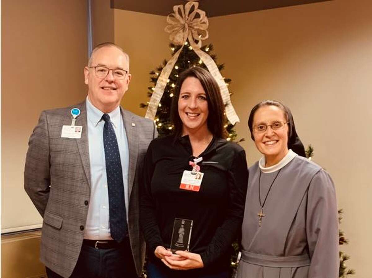 Pictured from left are Jerry Rumph, president; Keely Nelson, ICU nursing manager; Sister M. Beata Ziegler, vice president of Support Services for OSF HealthCare Saint Anthony’s Health Center.