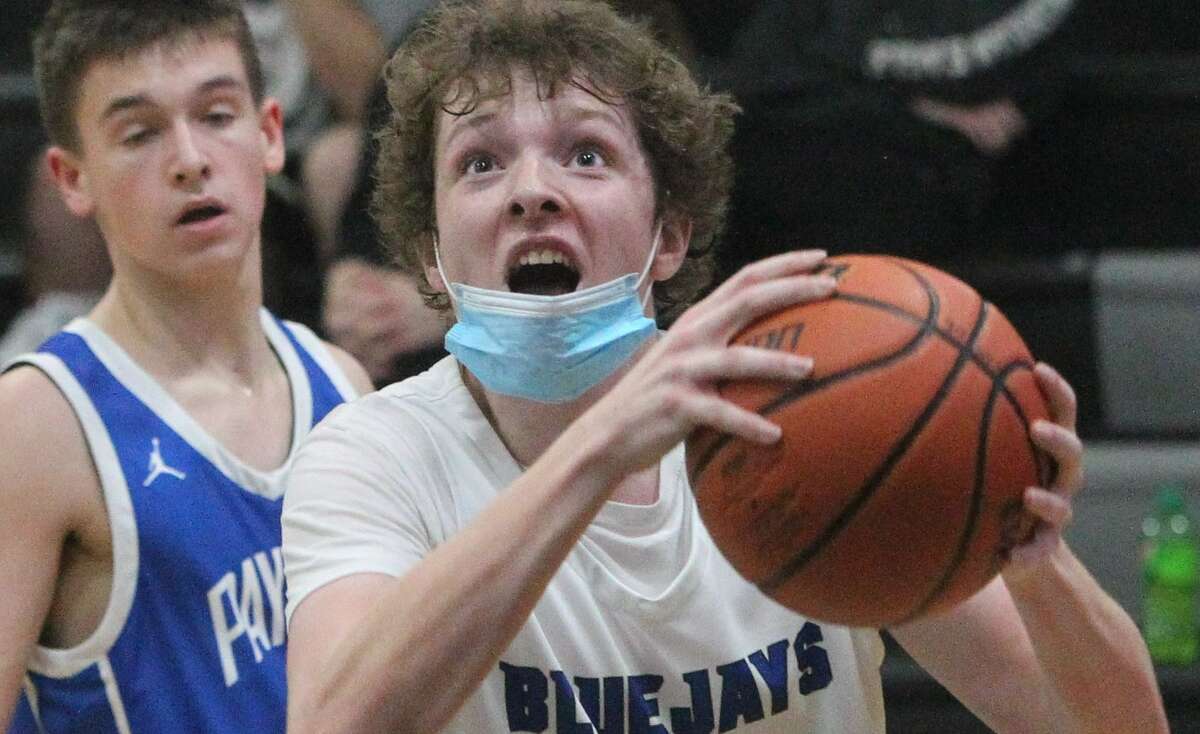 Action from the PORTA/A-C Central boys' basketball team's win over Payson Seymour in the quarterfinals of the Winchester Invitational Tournament