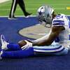 Anthony Brown of the Dallas Cowboys sits in the end zone after being called for pass interference against the Las Vegas Raiders at AT&T Stadium on November 25, 2021 in Arlington, Texas.