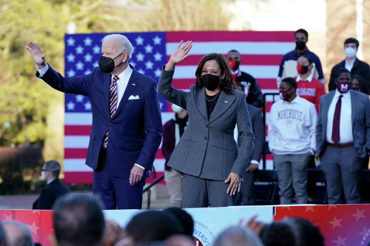 President Joe Biden and Vice President Kamala Harris wave as they depart after speaking in support of changing the Senate filibuster rules to ensure the right to vote is defended, at Atlanta University Center Consortium, on the grounds of Morehouse College and Clark Atlanta University, Tuesday, Jan. 11, 2022, in Atlanta.