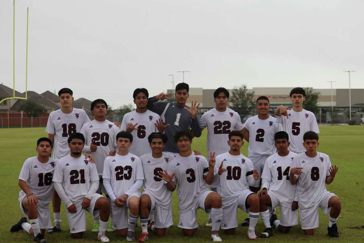 The Northbrook soccer team poses after beating Chavez 7-1 to finish the early season Cy-Fair ISD Showcase tournament 2-0-1. Some of the players hold up seven fingers for the seven goals that the Raiders scored in the win.
