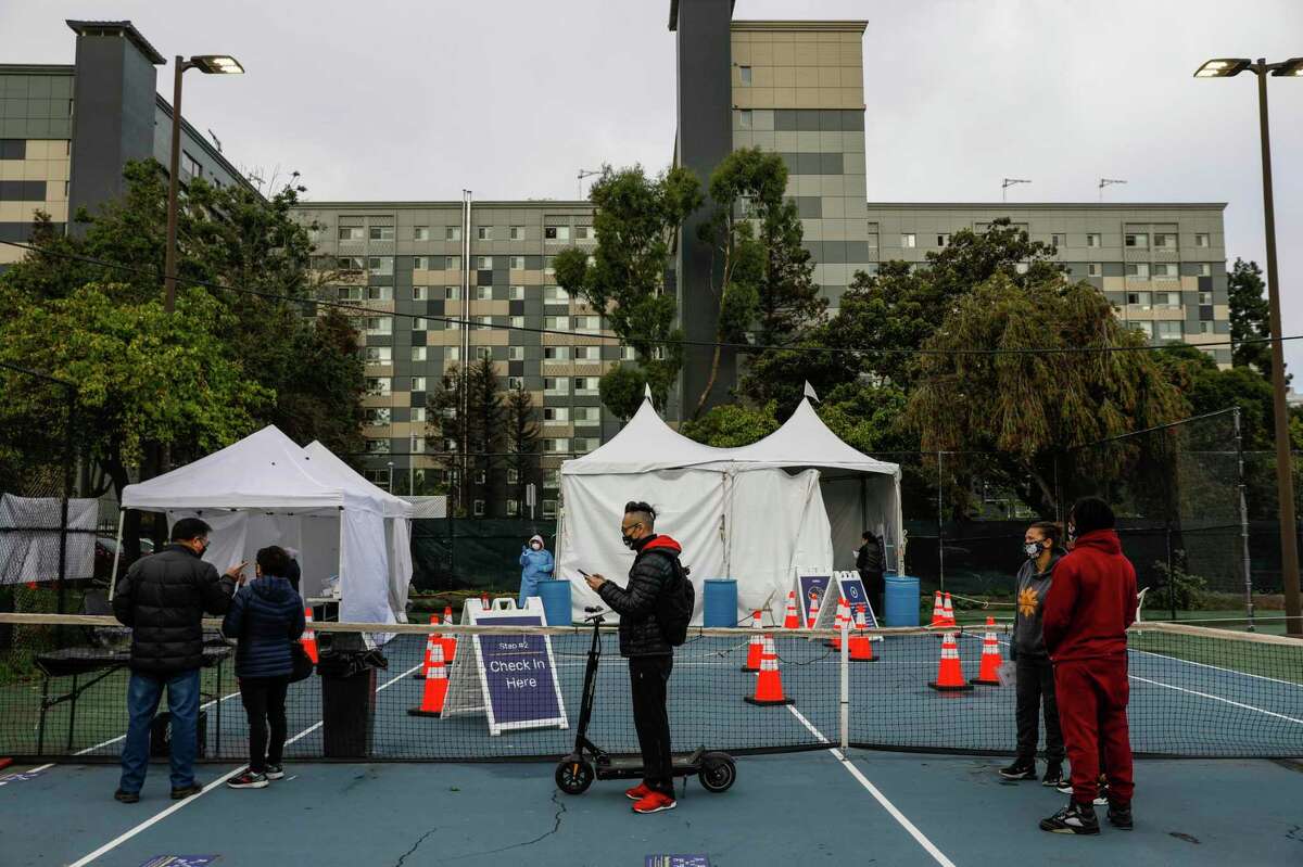 People wait in line to get tested for COVID-19 at the Ella Hill Hutch Community Center on Golden Gate Avenue on Friday, Jan. 7, 2022 in San Francisco.