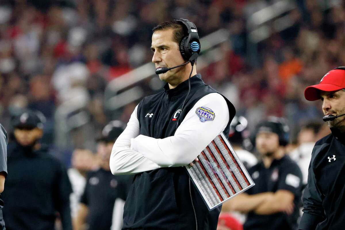 Cincinnati coach Luke Fickell watches from the sideline during the first half of the Cotton Bowl NCAA College Football Playoff semifinal game against Alabama, Friday, Dec. 31, 2021, in Arlington, Texas. (AP Photo/Michael Ainsworth)