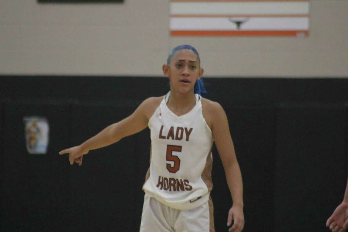 Dobie's Jacque Giron directs things on the court during Wednesday night's showdown with Deer Park. Giron scored 11 second-half points to spark the team to a share of first place.