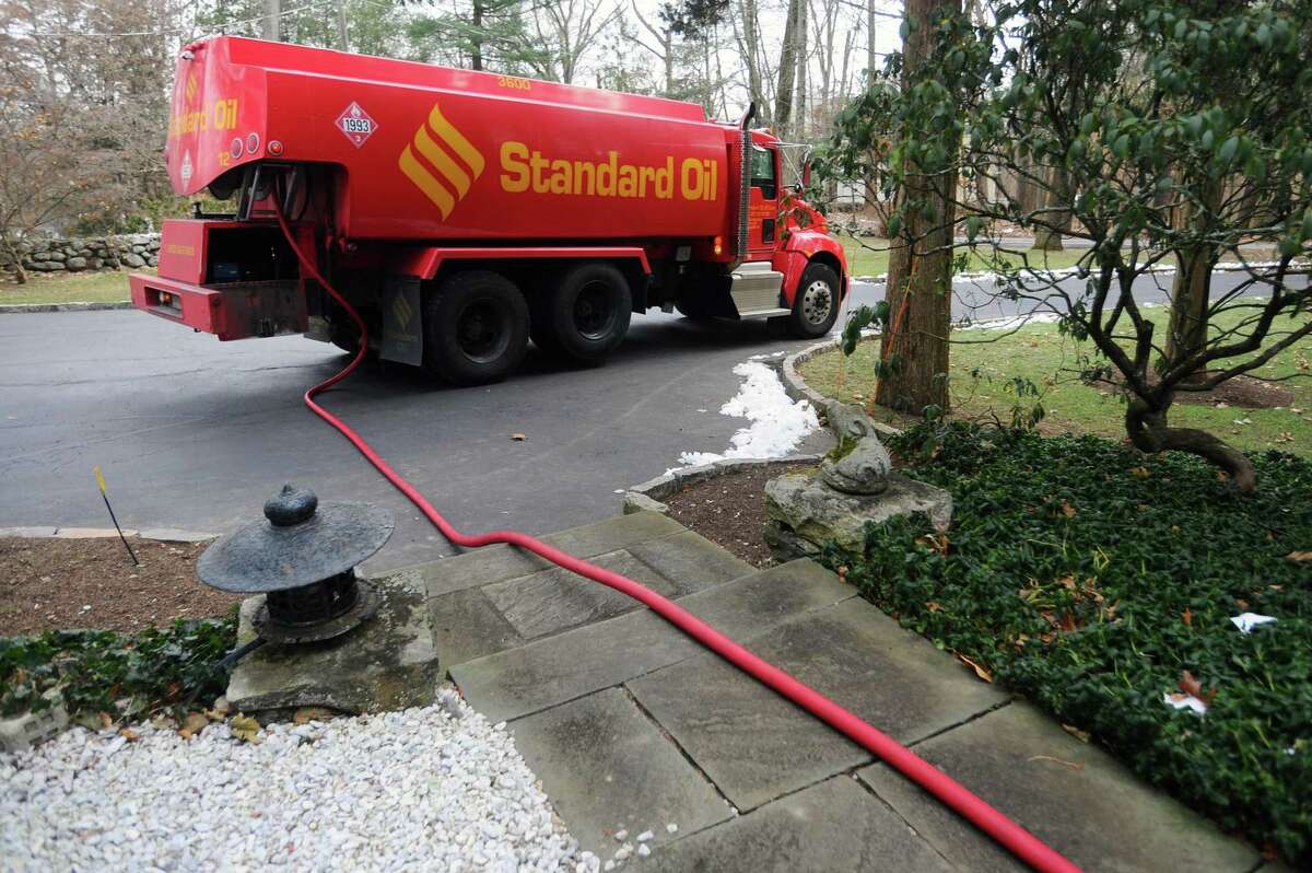 A Standard Oil truck is parked on a Dogwood Lane driveway while making a delivery in north Stamford, Conn. on Wednesday, Dec. 13, 2017.