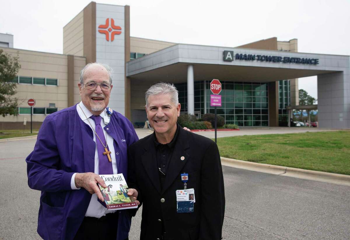 Rev. Thomas Tucker, left, a volunteer emergency department chaplain, poses for a photograph with Todd Caliva, CEO of HCA Houston Clear Lake, Friday, Jan. 7, 2022, in Webster. Tucker has been a chaplain for years, then COVID happened, started doing work on Zoom, now he is back. He recently wrote a book about his experience, he encourages others to tap into their own to their spiritual gifts and discover how to help others.