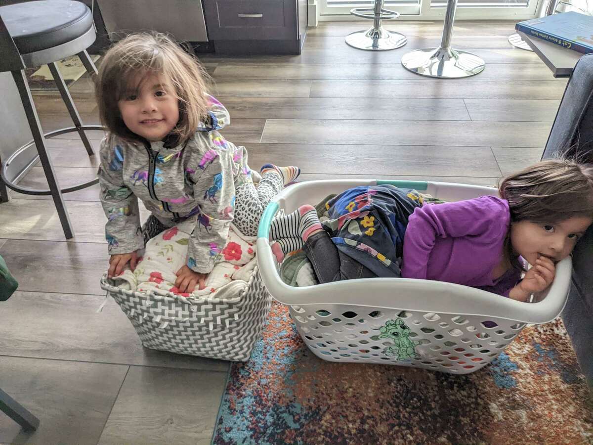 Aubree (left) and Juniper Somauroo with their possessions.