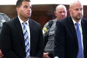 Former Hamden police Officer Devin Eaton, left, in court in 2019. At right is his attorney, Gregory Cerritelli.
