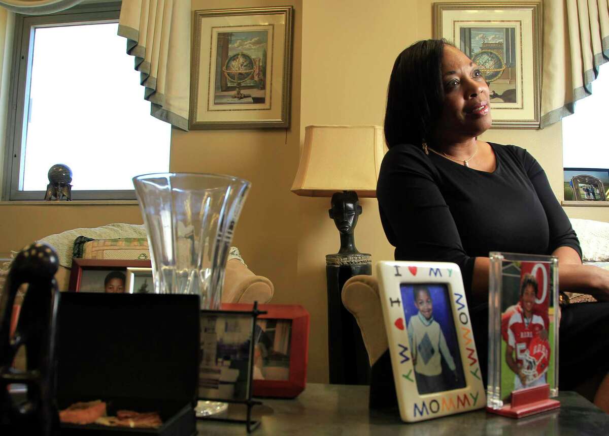 Federal Judge Vanessa Gilmore in her office with a photograph of her son, Sean, 13, Monday, Jan. 13, 2014, in Houston.