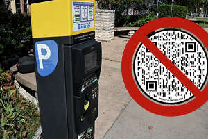 Scammers are putting fraudulent QR codes on Texas parking meters