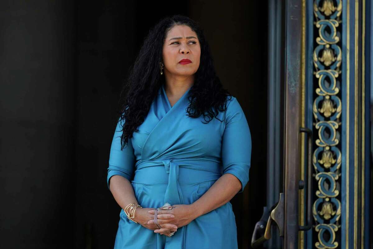 San Francisco Mayor London Breed listens during a briefing outside City Hall in San Francisco on Dec. 1, 2021. 