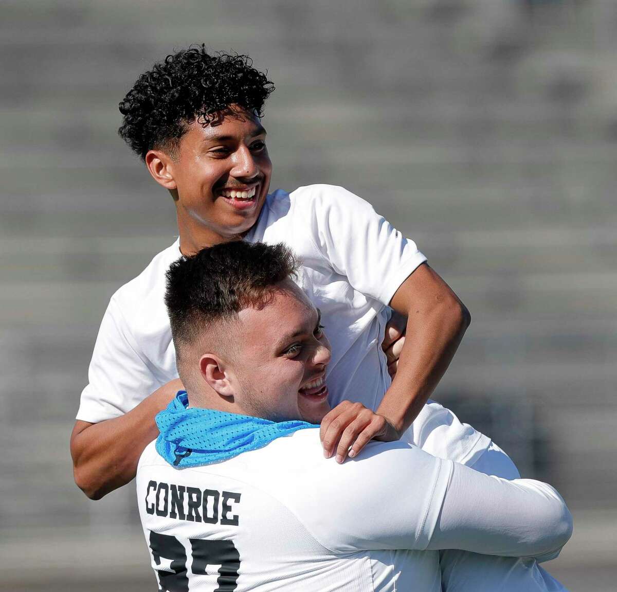 Conroe’s Ulises Quintanilla (7) celebrates his game-winning goals in the 77th minute with Carlos Espinoza in the second period of a high school soccer match at Turner Stadium, Thursday, Jan. 13, 2022, in Humble.