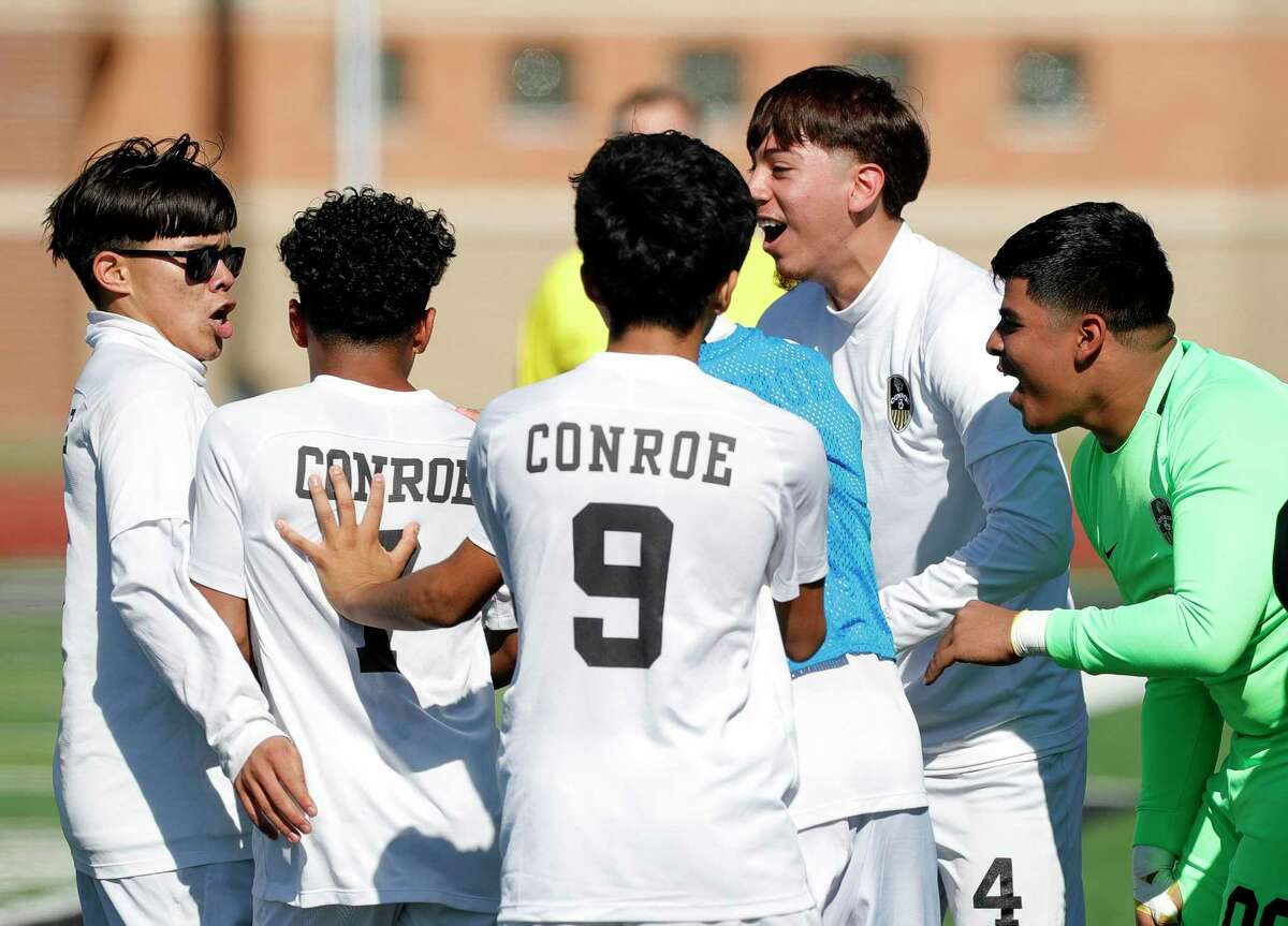 Conroe players celebrate Ulises Quintanilla’s game-winning goals in the 77th minute in the second period of a high school soccer match at Turner Stadium, Thursday, Jan. 13, 2022, in Humble.