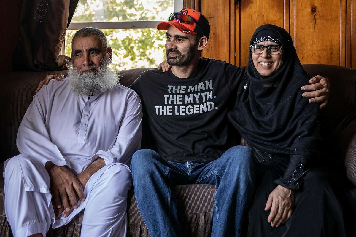 ***** FOR PROJECT ONLY. DO NOT USE. NOT A FILE ***** Umer Hayat, left and wife Salma, right, sit for a portrait with their son Hamid at their home in Stockton, California Friday, May 28, 2021. Hayat, 38, was wrongfully convicted in a 2006 trial for allegedly supporting terrorists by training at an al-Qaeda training camp during a family visit to Pakistan. He was incarcerated in federal prison for 14 years before his case was overturned in 2019 after a judge deemed Hayat was ineffectively defended by an inexperienced attorney's failure to call alibi witnesses in addition to a coerced confession obtained by the FBI.