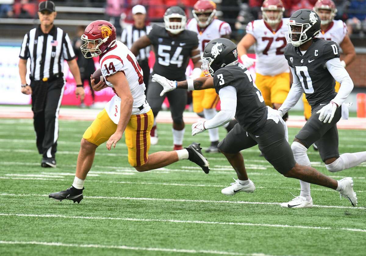 PULLMAN, WA - SEPTEMBER 18: USC wide receiver Joseph Manjack IV (14) runs away from Washington State defensive back Daniel Isom (3) on this reception during the game between the Washington State Cougars and the USC Trojans on September 18, 2021 at Martin Stadium in Pullman, WA. (Photo by Robert Johnson/Icon Sportswire via Getty Images)