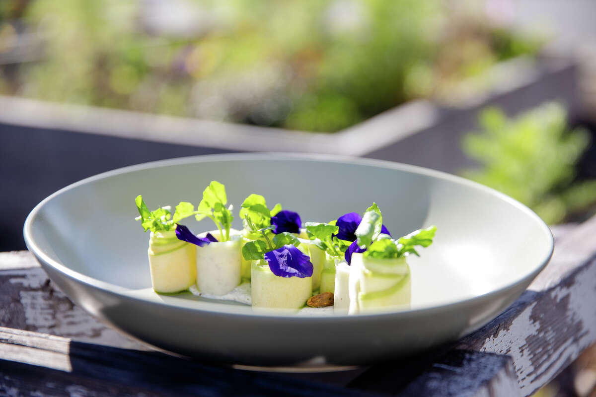A green apple and kohlrabi salad with sumac yogurt, pistachios, and water cress is one of the dishes at All Spice restaurant in San Mateo, Calif. on Jan. 11, 2022.