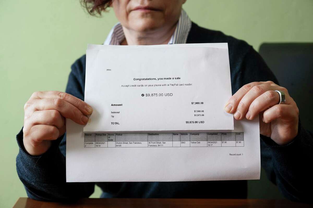Margarita Bekker shows the printed Paypal record of the Yellow Cab receipt.