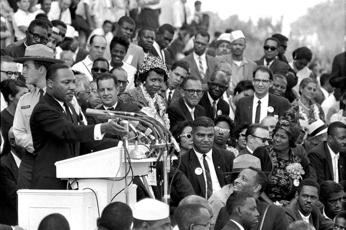 In this Aug. 28, 1963, the Rev. Dr. Martin Luther King Jr., head of the Southern Christian Leadership Conference, speaks to thousands during his "I Have a Dream" speech in front of the Lincoln Memorial for the March on Washington for Jobs and Freedom, in Washington.