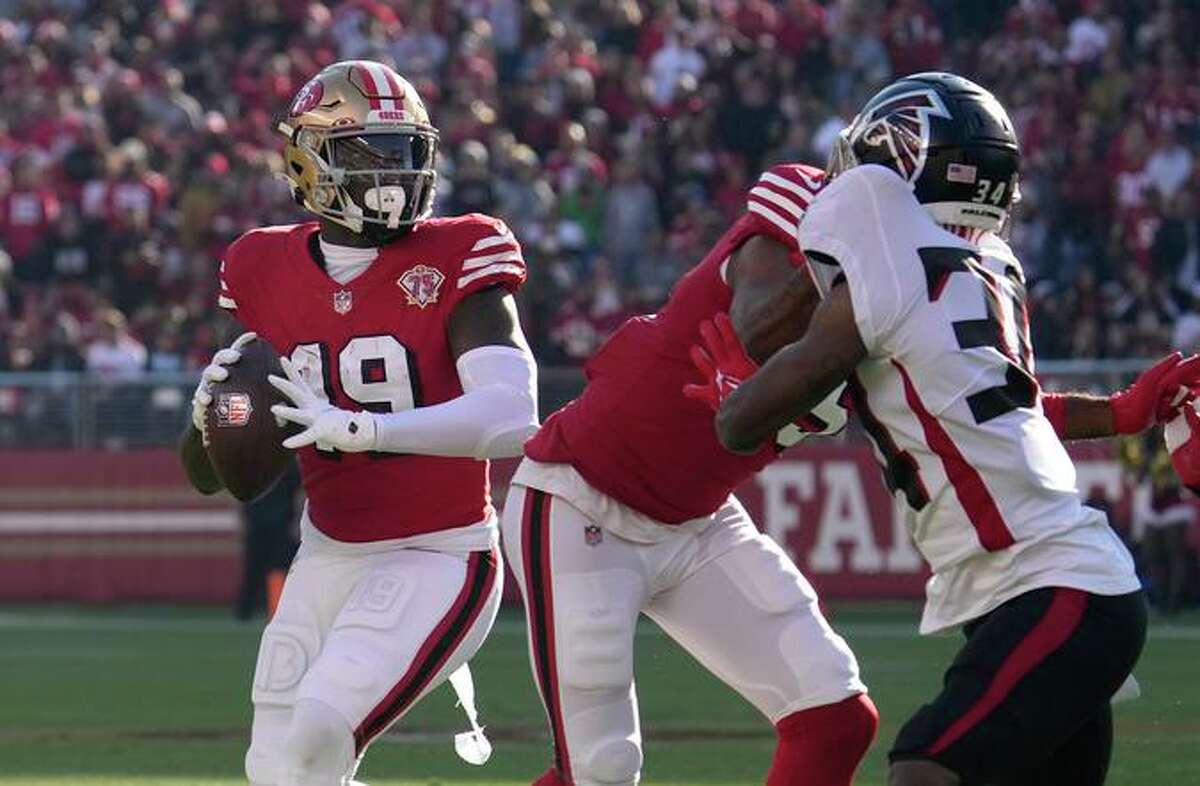 San Francisco 49ers wide receiver Deebo Samuel (19) throws a pass against the Atlanta Falcons during the first half of an NFL football game in Santa Clara, Calif., Sunday, Dec. 19, 2021. (AP Photo/Tony Avelar)