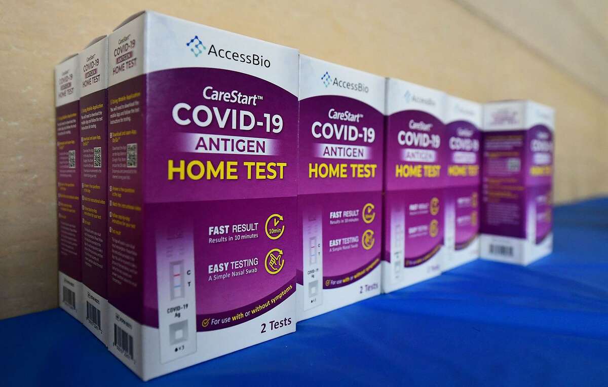 Rapid COVID-19 test kits await distribution for free to people receiving their COVID-19 vaccines or boosters at Union Station in Los Angeles, California, on Jan. 7, 2022.